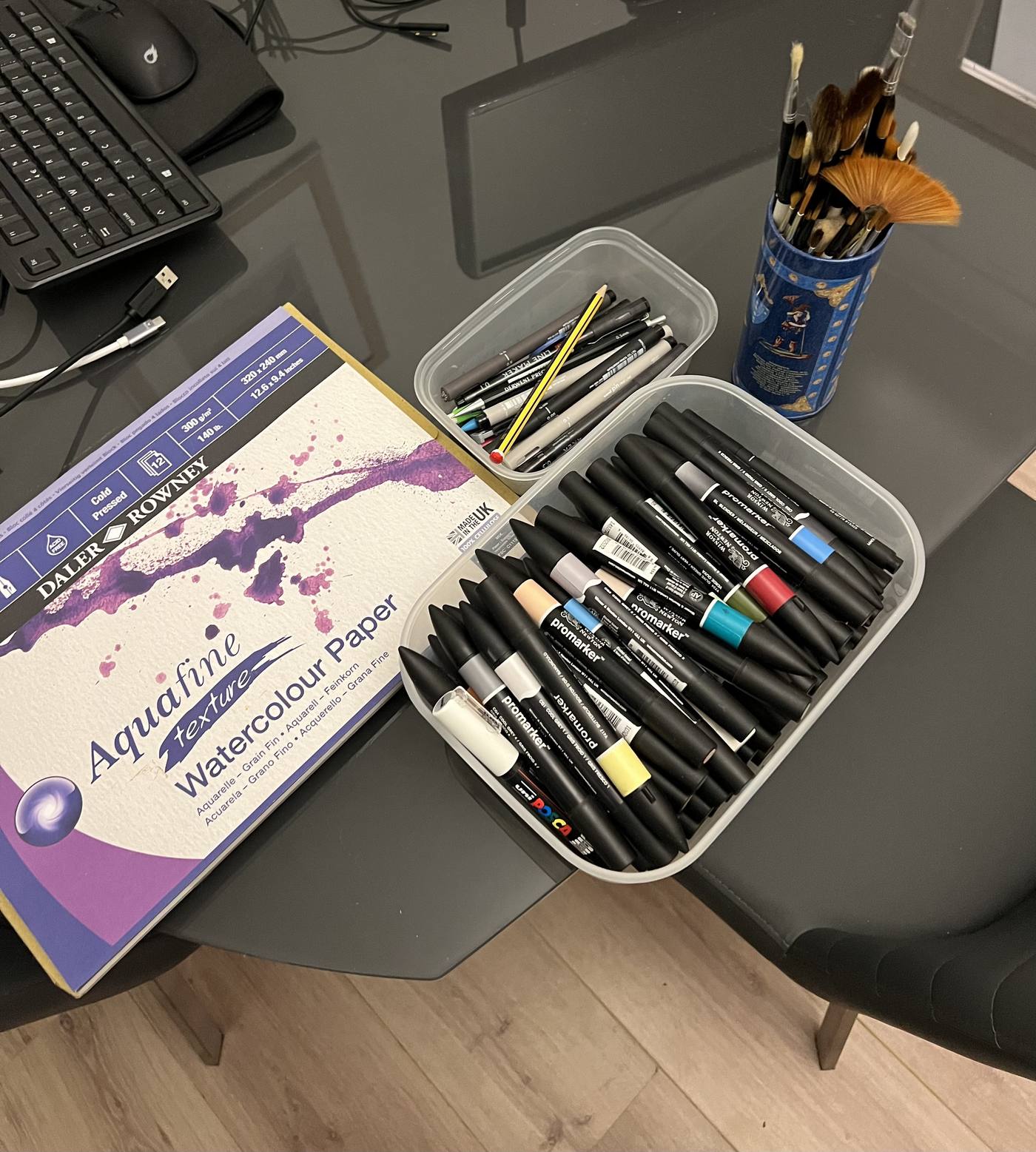 Collection of pens, markers and paintbrushes
