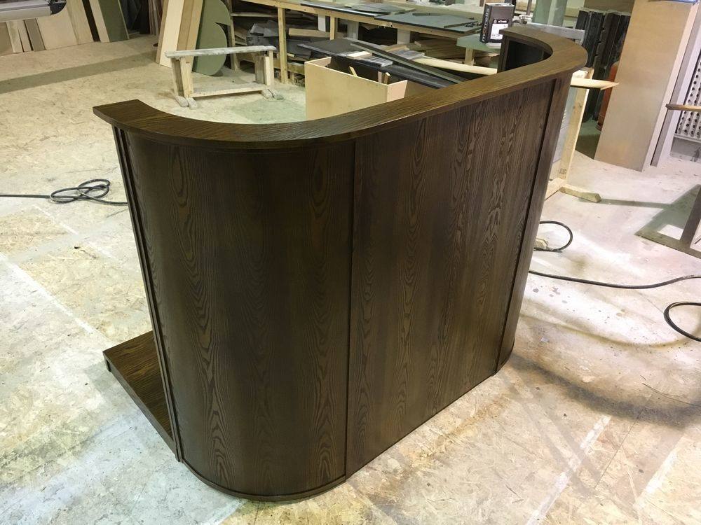 Curved dark oak bar unit