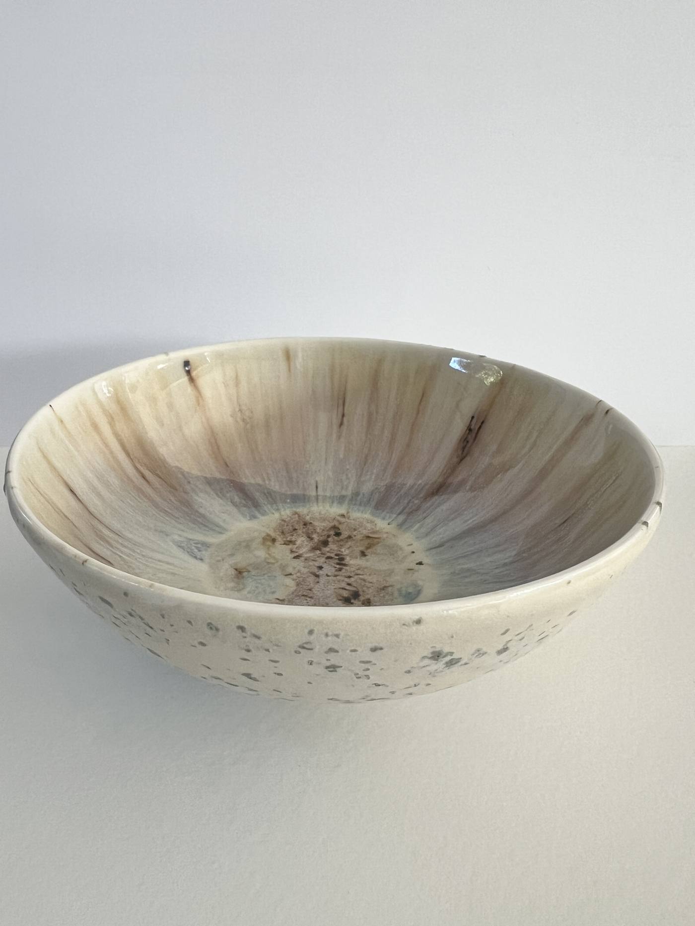 Bowl with cream and grey drip glaze